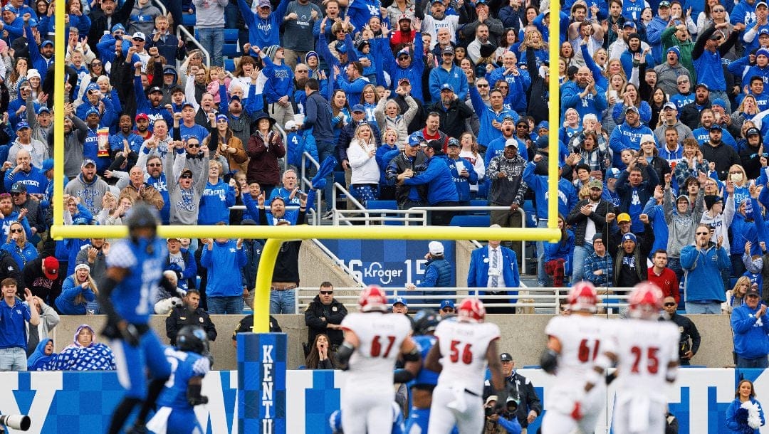 Kentucky fans celebrate an interception against Louisville during an NCAA college football game in Lexington, Ky., Saturday, Nov. 26, 2022.