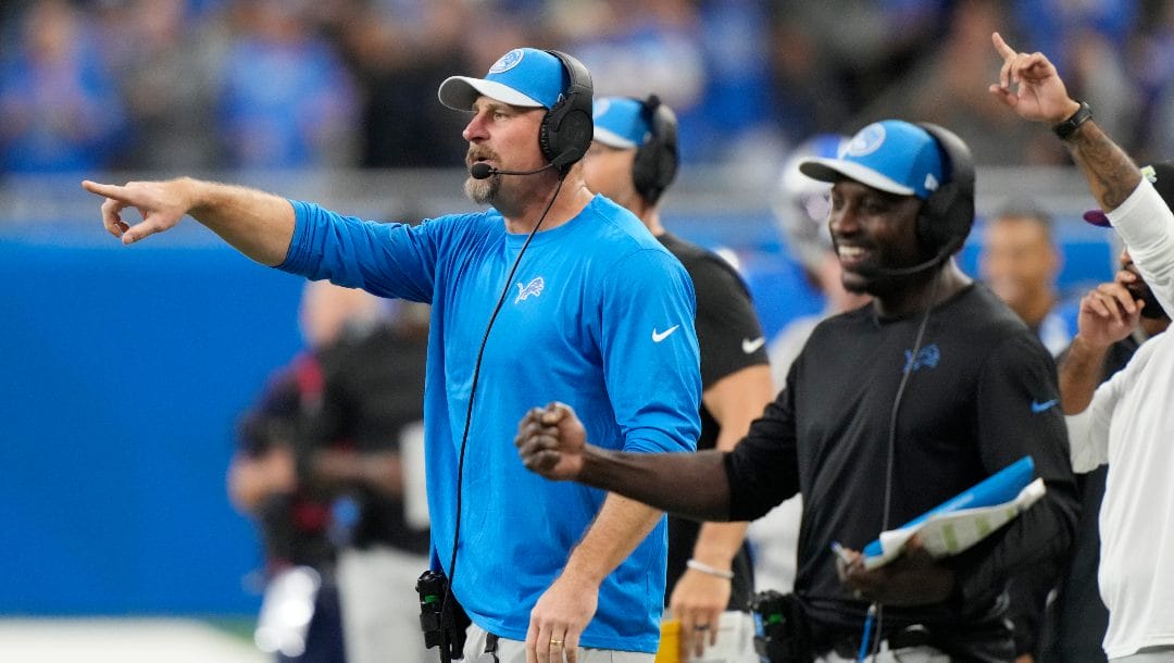 Detroit Lions head coach Dan Campbell, left, on the sideline during the first half of an NFL football game against the Carolina Panthers, Sunday, Oct. 8, 2023, in Detroit.