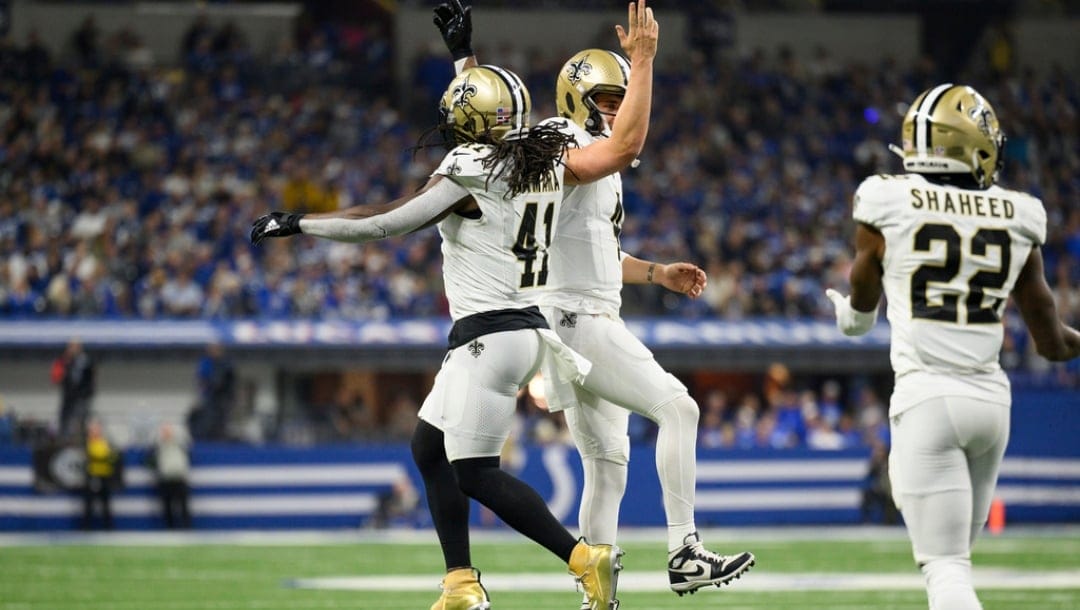 New Orleans Saints running back Alvin Kamara (41) and New Orleans Saints quarterback Derek Carr (4) celebrate a touchdown during an NFL football game against the Indianapolis Colts, Sunday, Oct. 29, 2023, in Indianapolis.