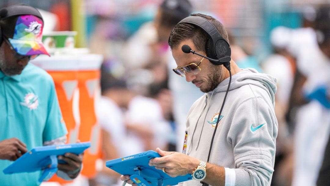 Miami Dolphins head coach Mike McDaniel looks at a Microsoft Surface on the sidelines during an NFL football game against the New York Giants, Sunday, Oct. 8, 2023, in Miami Gardens, Fla.