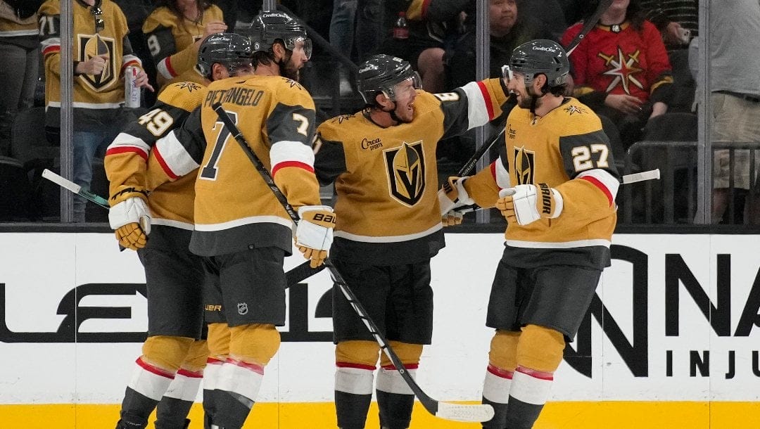 Vegas Golden Knights right wing Jonathan Marchessault, second from right, celebrates after scoring against the Colorado Avalanche during the third period of an NHL preseason hockey game Thursday, Oct. 5, 2023, in Las Vegas.