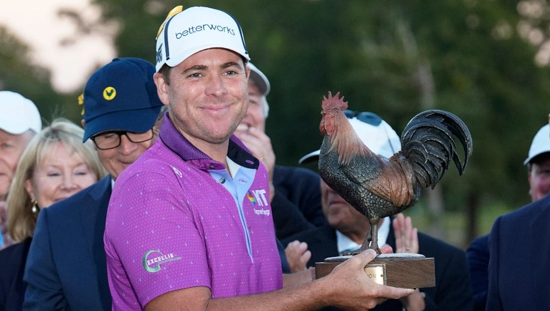 Luke List holds the winner's trophy after his victory in the Sanderson Farms Championship, Sunday, Oct. 8, 2023, in Jackson, Miss.