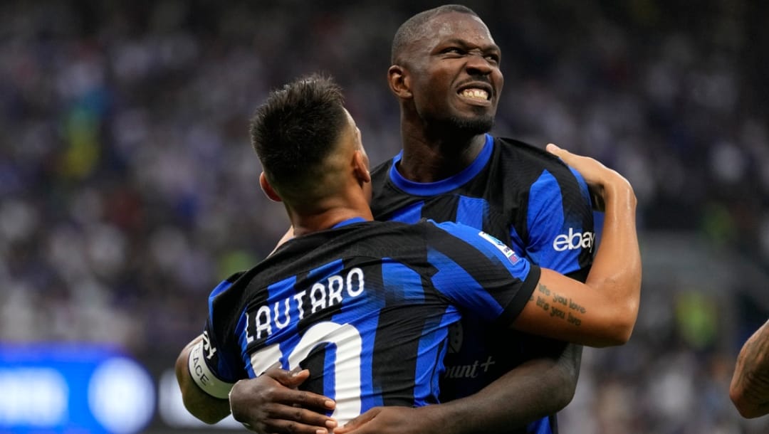 Inter Milan's Lautaro Martinez, left, celebrates with Inter Milan's Marcus Thuram after scoring his sides second goal during the Serie A soccer match between Inter Milan and Fiorentina at the San Siro Stadium, in Milan, Italy, Sunday, Sept. 3, 2023.