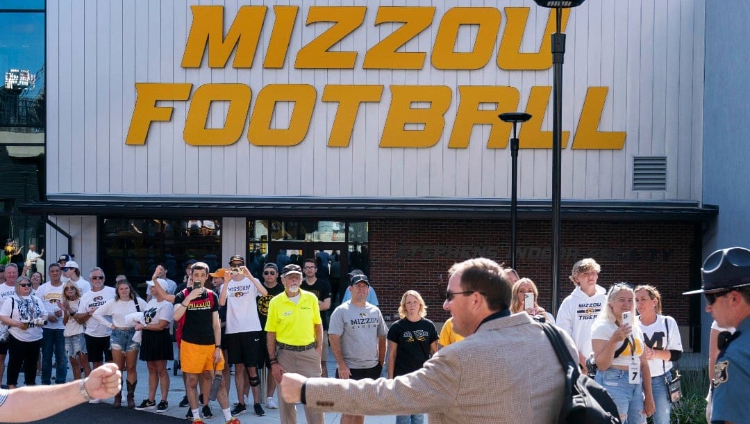 Missouri head coach Eliah Drinkwitz greets fans as he enters Memorial Stadium before the start of an NCAA college football game against Middle Tennessee, Saturday, Sept. 9, 2023, in Columbia, Mo. (AP Photo/L.G. Patterson)