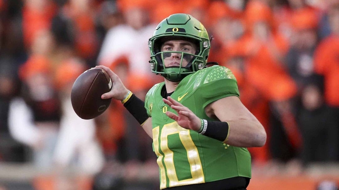 Oregon quarterback Bo Nix (10) plays during an NCAA college football game against Oregon State in this Saturday, Nov 26, 2022, file photo in Corvallis, Ore. The Holiday Bowl will usher in a new era with potentially a retro look. The No. 15 Oregon Ducks will play North Carolina on Wednesday, Dec. 28, 2022, at Petco Park, the downtown home of baseball's Padres. It'll be the first football game at the ballpark and the first Holiday Bowl since 2019.