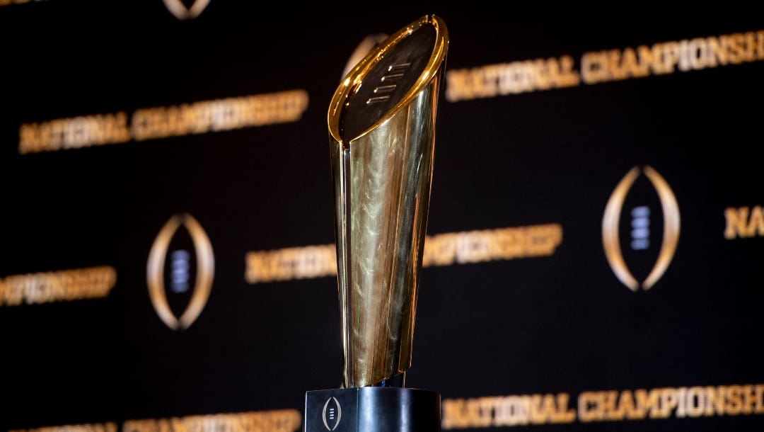 The championship trophy stands on a table during a news conference ahead of the national championship NCAA College Football Playoff game between Georgia and TCU, Sunday, Jan. 8, 2023, in Los Angeles. The championship football game will be played Monday. (AP Photo/Mike Stewart)