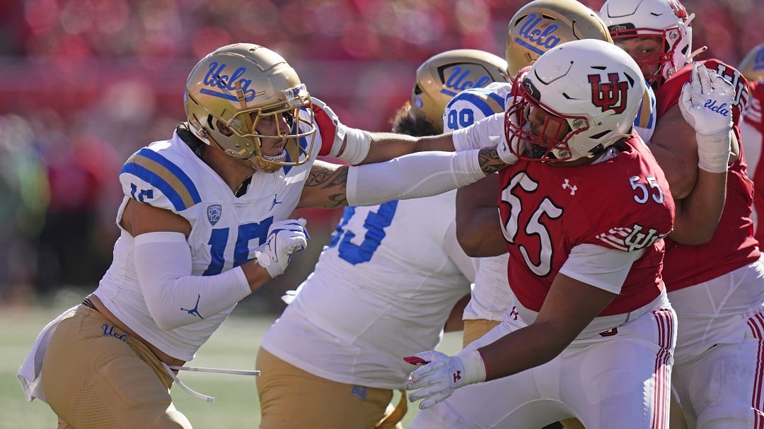 UCLA defensive lineman Laiatu Latu (15) battles with Utah offensive lineman Spencer Fano (55) during the second half of an NCAA college football game, Saturday, Sept. 23, 2023, in Salt Lake City.