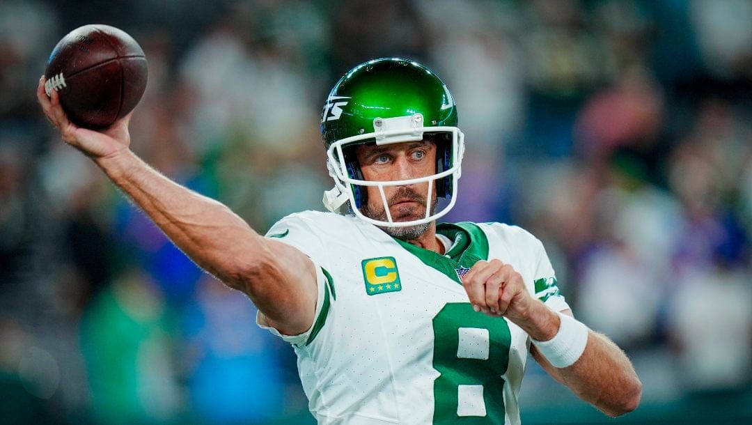 New York Jets quarterback Aaron Rodgers (8) warms up before an NFL football game against the Buffalo Bills on Monday, Sept. 11, 2023, in East Rutherford, N.J.