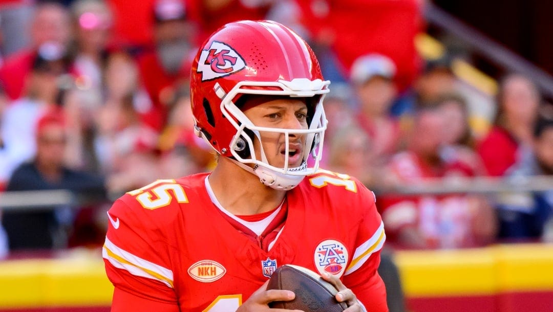 Kansas City Chiefs quarterback Patrick Mahomes looks to pass against the Los Angeles Chargers during the first half of an NFL football game, Sunday, Oct. 22, 2023 in Kansas City, Mo.