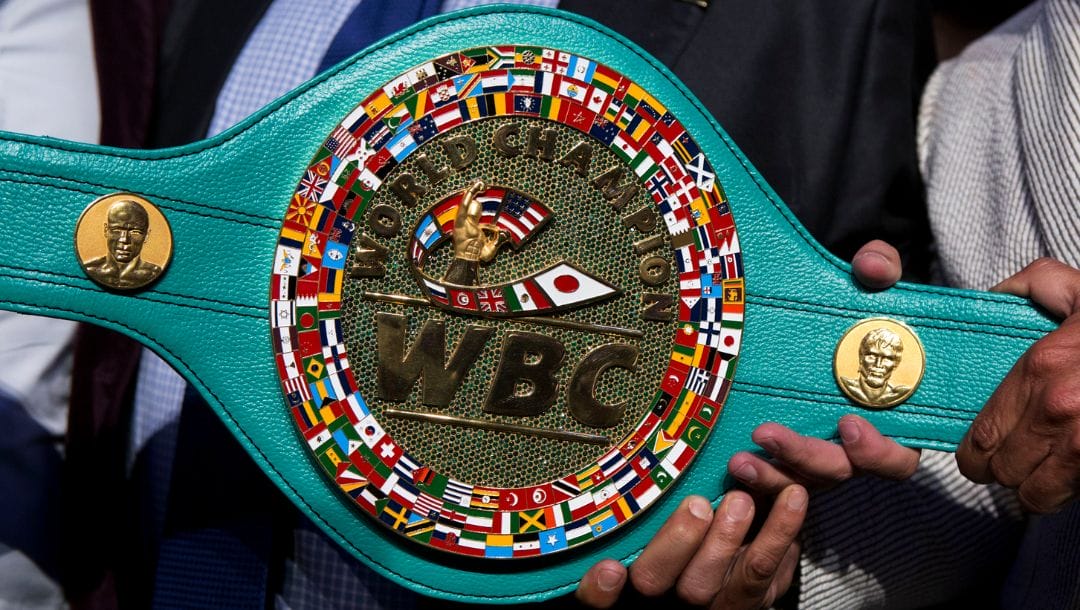 Mauricio Sulaiman, president of the World Boxing Council, holds up the "Cinturon Esmeralda" or Emerald Belt.
