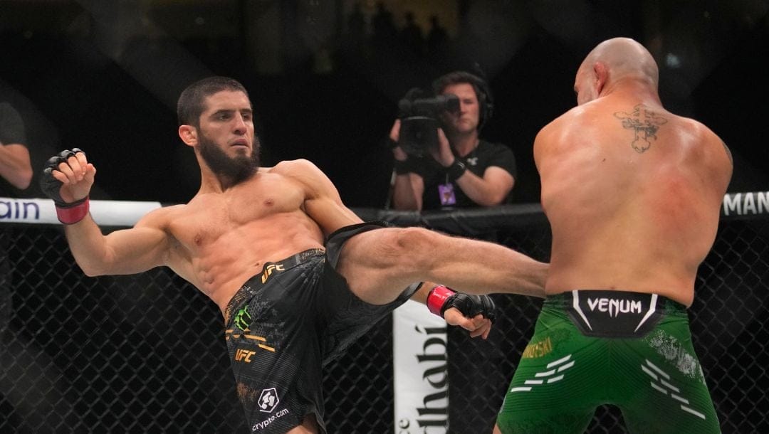 Islam Makhachev of Russia, left, battles Alex Volkanovski of Australia in the UFC lightweight championship fight during UFC 294.