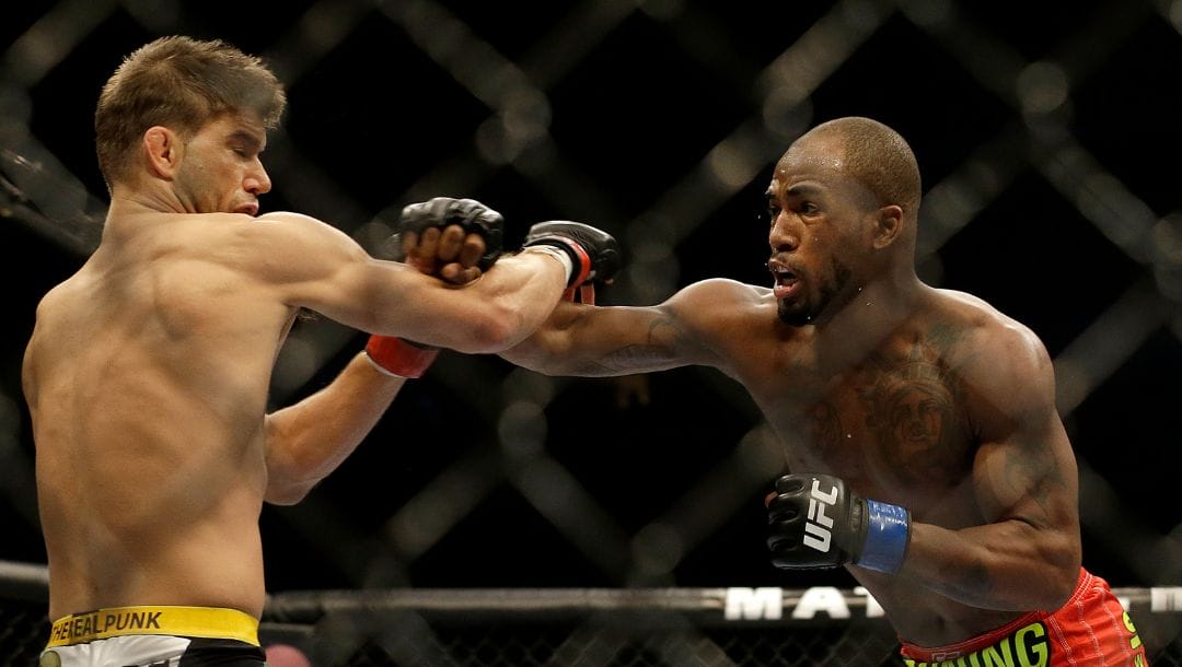 Bobby Green punches Josh Thomson during the first round of a lightweight mixed martial arts bout at a UFC event.
