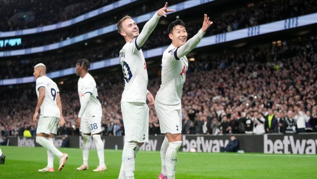 Tottenham's James Maddison, centre, celebrates with Tottenham's Son Heung-min after scoring his side's second goal during the English Premier League soccer match between Tottenham Hotspur and Fulham at the Tottenham Hotspur Stadium in London, Monday, Oct. 23, 2023.