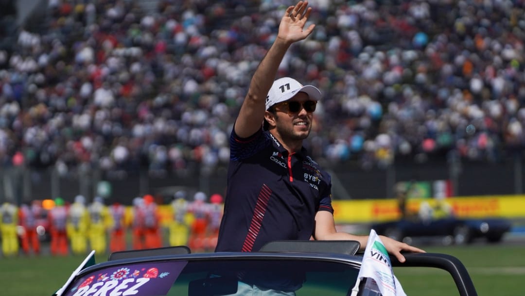 Red Bull driver Sergio Perez of Mexico greets spectators during drivers parade before the Formula One Mexico Grand Prix auto race at the Hermanos Rodriguez racetrack in Mexico City, Sunday, Oct. 29, 2023.