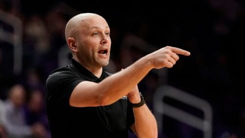 Abilene Christian head coach Brette Tanner talks to his players during the first half of an NCAA college basketball game against Kansas State Tuesday, Dec. 6, 2022, in Manhattan, Kan. (AP Photo/Charlie Riedel)