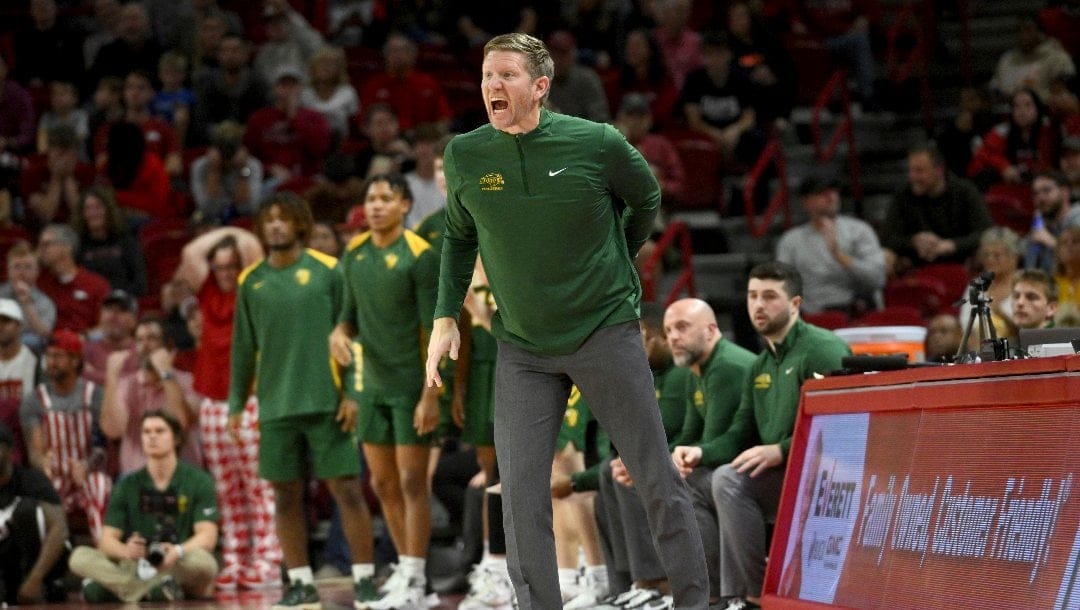 North Dakota State coach David Richman talks to his team as they run a play against Arkansas during the second half of an NCAA college basketball game Monday, Nov. 7, 2022, in Fayetteville, Ark. (AP Photo/Michael Woods)