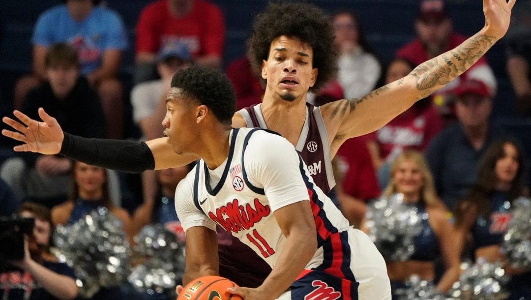 Texas A&M forward Andersson Garcia (11) guards Mississippi guard Matthew Murrell (11) during the first half of an NCAA college basketball game in Oxford, Miss., Tuesday, Feb. 28, 2023. Texas A&M won 69-61. (AP Photo/Rogelio V. Solis)