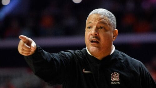 Alabama A&M's head coach Otis Hughley Jr. signals during the second half of an NCAA college basketball game against Illinois, Saturday, Dec. 17, 2022, in Champaign, Ill. (AP Photo/Michael Allio)