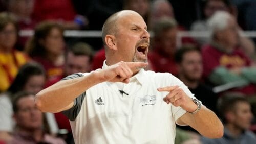 North Dakota head coach Paul Sather directs his team during the first half of an NCAA college basketball game against Iowa State, Wednesday, Nov. 30, 2022, in Ames, Iowa. (AP Photo/Charlie Neibergall)