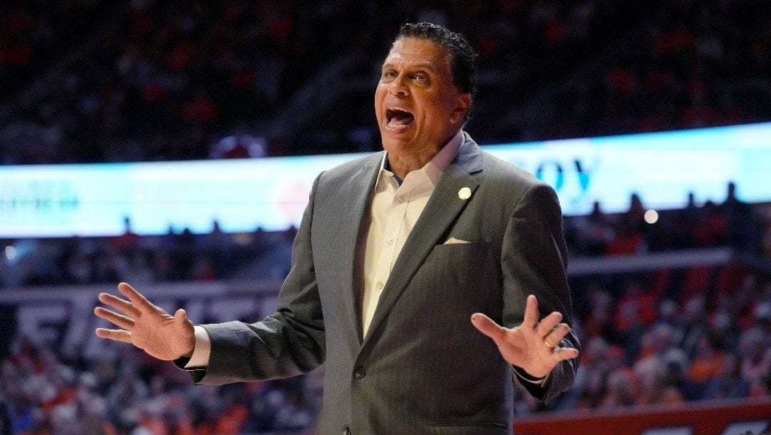 Bethune-Cookman head coach Reggie Theus talks to a referee during an NCAA college basketball game against Illinois Thursday, Dec. 29, 2022, in Champaign, Ill. (AP Photo/Charles Rex Arbogast)