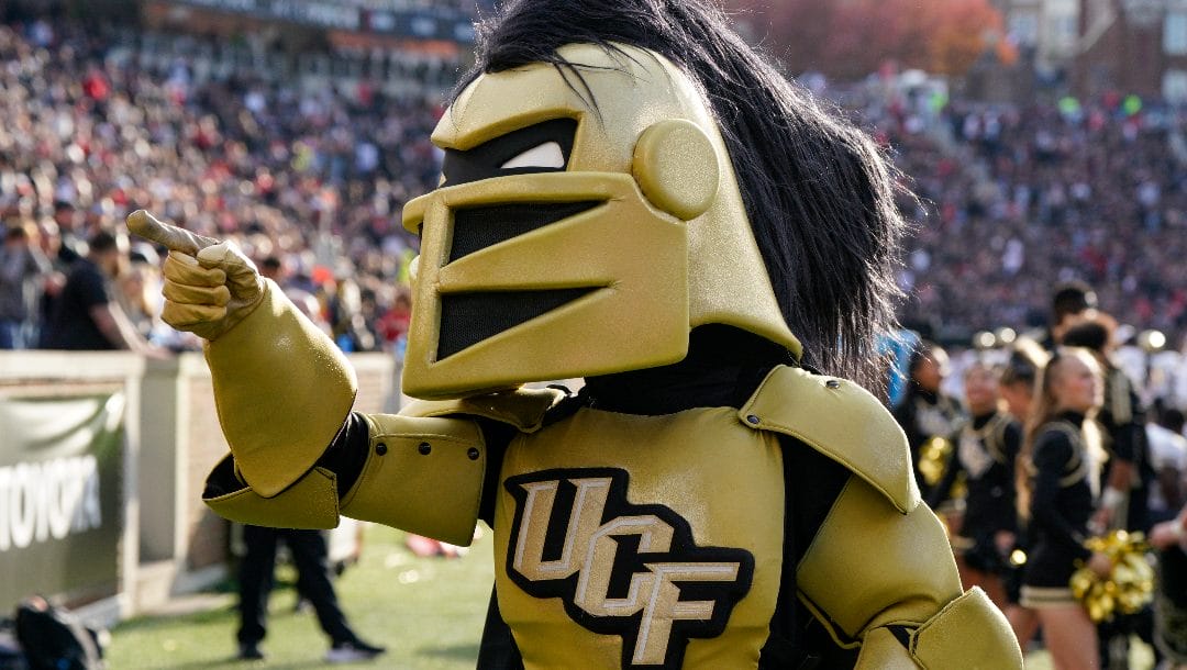 Central Florida mascot Knightro gestures during the first half of an NCAA college football game against Cincinnati, Saturday, Nov. 4, 2023, in Cincinnati.