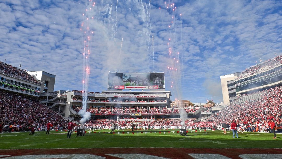 Fireworks go off at Donald W Reynolds Razorback Stadium as the Arkansas Razorbacks take the field to play the Auburn Tigers during an NCAA college football game Saturday, Nov. 11, 2023, in Fayetteville, Ark.