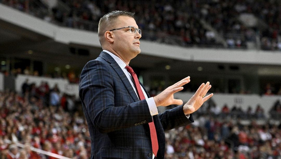 Bradley coach Brian Wardle talks to his team as they play against Arkansas during the second half of an NCAA college basketball game, Saturday, Dec. 17, 2022, in North Little Rock, Ark.