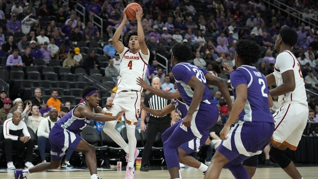 Southern California guard Oziyah Sellers (4) shoots against Kansas State during the first half of an NCAA college basketball game Monday, Nov. 6, 2023, in Las Vegas.