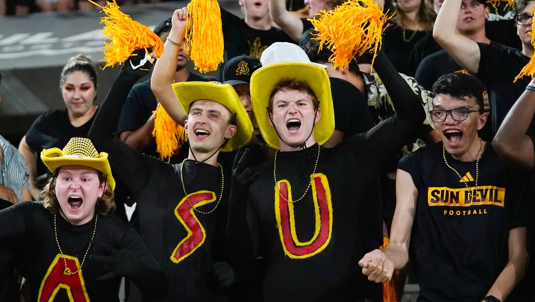 Arizona State student section fans cheer after a Sun Devils touchdown against Oklahoma State during the first half of an NCAA college football game Saturday, Sept. 9, 2023, in Tempe, Ariz. (AP Photo/Ross D. Franklin)
