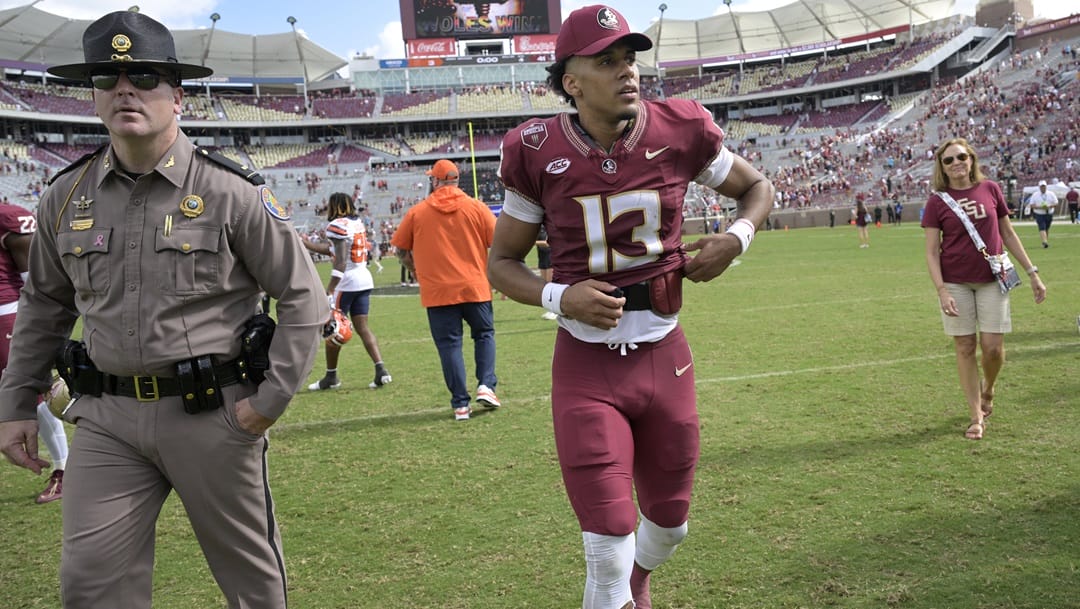 Florida State quarterback Jordan Travis (13) leaves the field after a win against Syracuse during an NCAA college football game, Saturday, Oct. 14, 2023, in Tallahassee, Fla.
