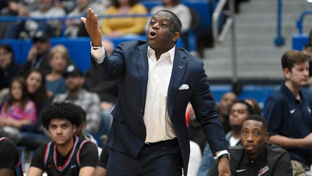 Delaware State head coach Stan Waterman gestures during the first half of an NCAA college basketball game against Connecticut, Sunday, Nov. 20, 2022, in Hartford, Conn.