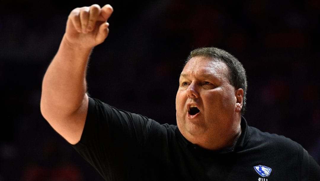 Eastern Illinois coach Marty Simmons reacts during the first half of an NCAA college basketball game against Illinois, Monday, Nov. 7, 2022, in Champaign, Ill.