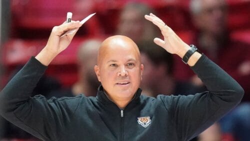 Idaho State head coach Ryan Looney looks on during the first half of an NCAA college basketball game against Utah, Monday, Nov. 14, 2022, in Salt Lake City. (AP Photo/Rick Bowmer)