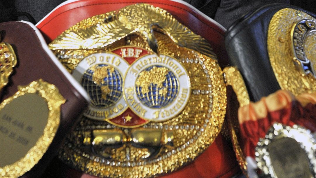 Ukrainian boxer Wladimir Klitschko, poses with his belts, during a press conference in London, Thursday, Oct. 21, 2010.
