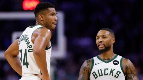 Damian Lillard #0 talks with Giannis Antetokounmpo #34 of the Milwaukee Bucks during the game against the Atlanta Hawks at Fiserv Forum on October 29, 2023 in Milwaukee, Wisconsin.