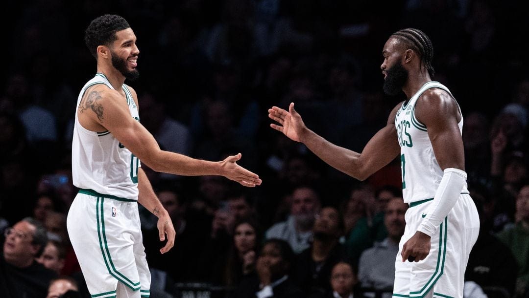 Jayson Tatum #0 of the Boston Celtics and Jaylen Brown #7 of the Boston Celtics react during the second quarter of the game.