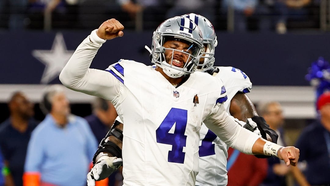 Dallas Cowboys quarterback Dak Prescott (4) reacts after a touchdown pass in the second half of an NFL football game against the Seattle Seahawks in Arlington, Texas, Thursday, Nov. 30, 2023.