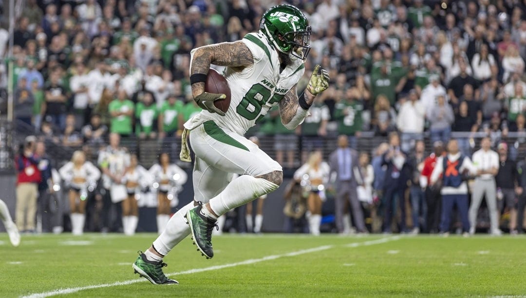 New York Jets tight end C.J. Uzomah (87) catches a pass and runs against the Las Vegas Raiders in an NFL football game, Sunday, Nov. 12, 2023, in Las Vegas, NV. Raiders defeated the Jets 16-12.