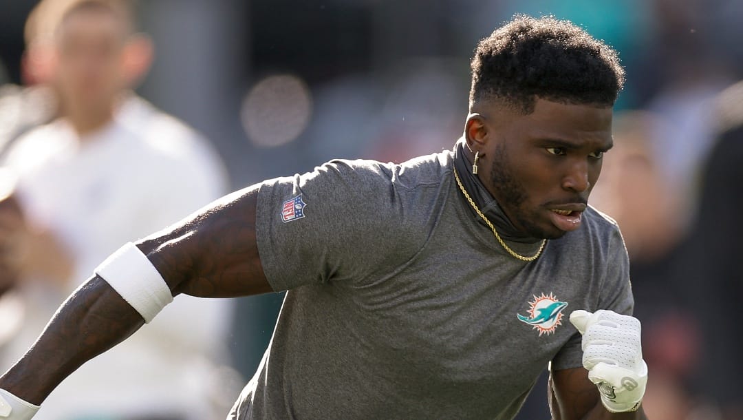 Miami Dolphins wide receiver Tyreek Hill warms up before playing against the New York Jets in an NFL football game, Friday, Nov. 24, 2023, in East Rutherford, N.J. (AP Photo/Adam Hunger)