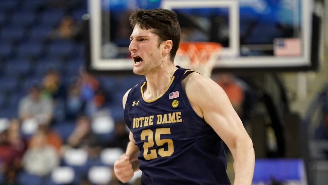 Notre Dame forward Matt Zona (25) celebrates making a 3-point basket Virginia Tech during the first half of an NCAA college basketball game at the Atlantic Coast Conference Tournament in Greensboro, N.C., Tuesday, March 7, 2023.