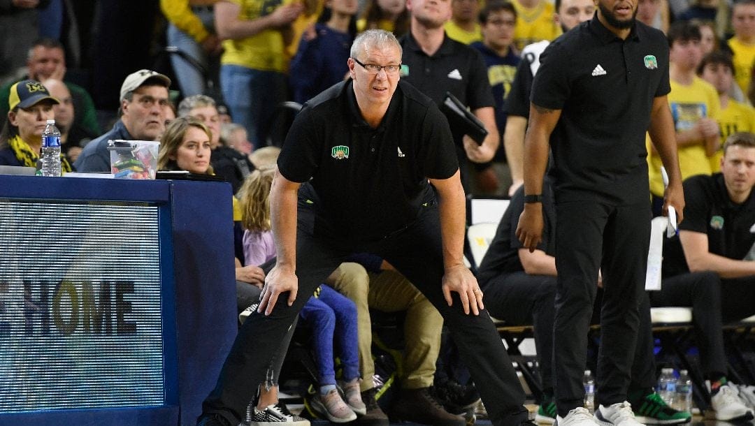 Ohio head coach Jeff Boals watches his team play against Michigan in the second half of an NCAA college basketball game, Sunday, Nov. 20, 2022, in Ann Arbor, Mich.