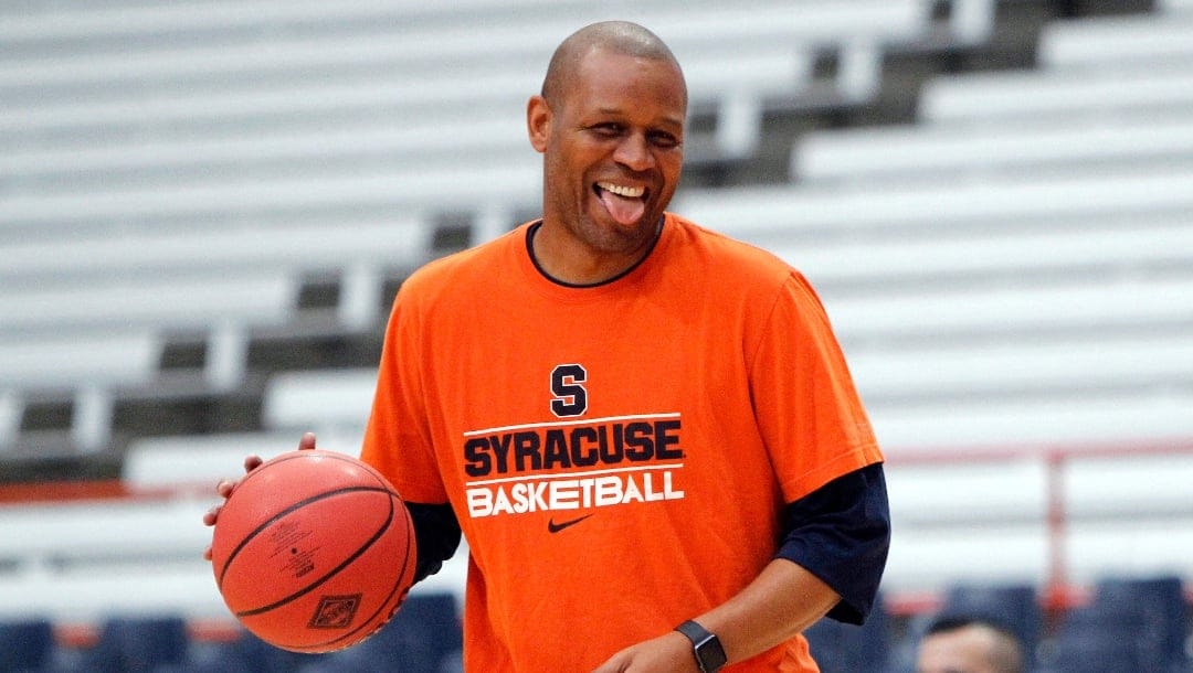FILE - Syracuse assistant coach Adrian Autry jokes with players before an NCAA college basketball in the NIT against Mississippi in Syracuse, N.Y., Saturday, March 18, 2017. Syracuse formally introduced new men's basketball coach Adrian Autry, Friday, March 10, 2023, but it turned into more of a celebration of Jim Boeheim, the Hall of Fame coach Autry is succeeding. (AP Photo/Nick Lisi, File)