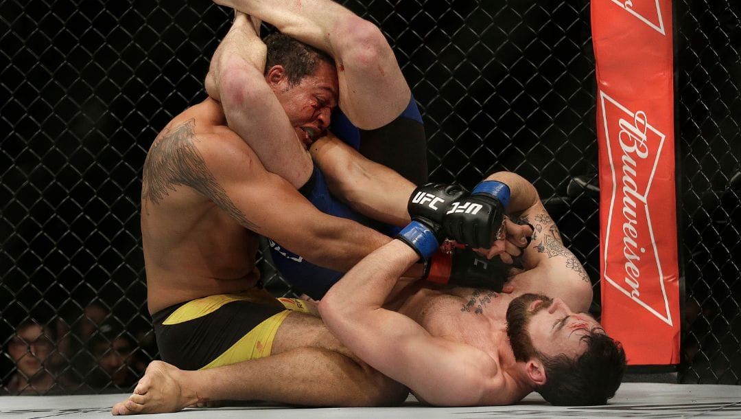 Paul Craig, bottom, applies an arm bar on Luiz Henrique da Silva during the second round of a UFC Fight Night.