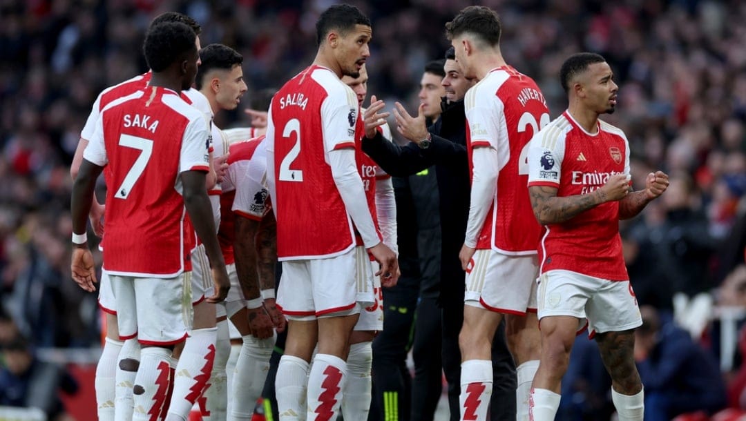 Arsenal's manager Mikel Arteta speaks to the players while Gabriel Jesus, right, gestures to the crowd during the English Premier League soccer match between Arsenal and Brighton and Hove Albion at the Emirates Stadium in London, Sunday, Dec. 17, 2023.