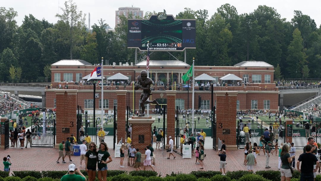 Charlotte fans arrive at McColl-Richardson Field before an NCAA college football game between the Charlotte and the Campbell in Charlotte, N.C., Saturday, Aug. 31, 2013.