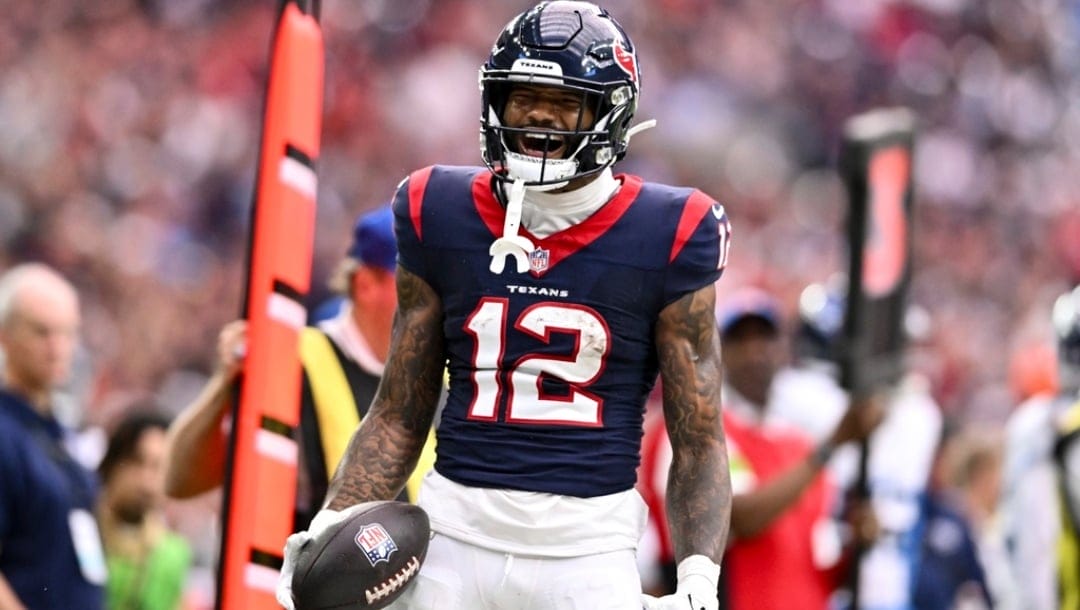 Houston Texans wide receiver Nico Collins (12) reacts against the Tennessee Titans during an NFL football game, Sunday, Dec 31, 2023, in Houston.