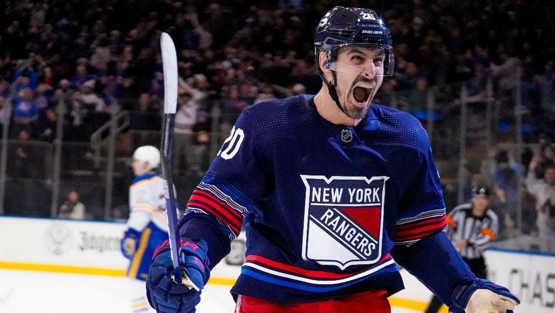 New York Rangers left wing Chris Kreider (20) celebrates after scoring the winning goal in overtime of an NHL hockey game against the Buffalo Sabres in New York, Saturday, Dec. 23, 2023.