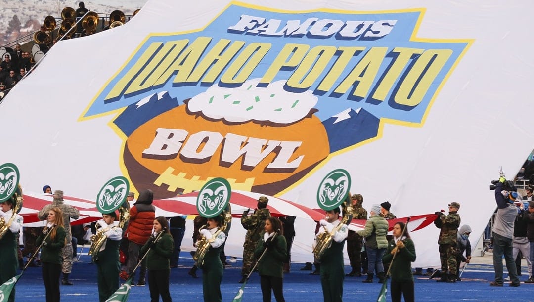 The Colorado State band performs in front of a large United States flag and the bowl logo banner before the Famous Idaho Potato Bowl NCAA college football game against Idaho in Boise, Idaho, Thursday, Dec. 22, 2016.