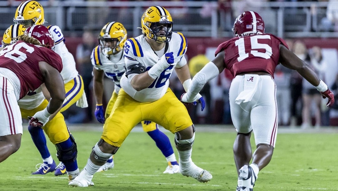 LSU offensive lineman Will Campbell (66) faces off against Alabama linebacker Dallas Turner (15) during the first half of an NCAA college football game, Saturday, Nov. 4, 2023, in Tuscaloosa, Ala.