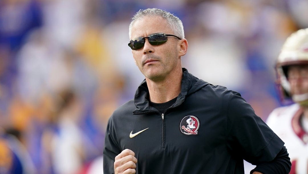 Florida State head coach Mike Norvell enters the field before an NCAA college football game against Pittsburgh in Pittsburgh, Saturday, Nov. 4, 2023. (AP Photo/Matt Freed)